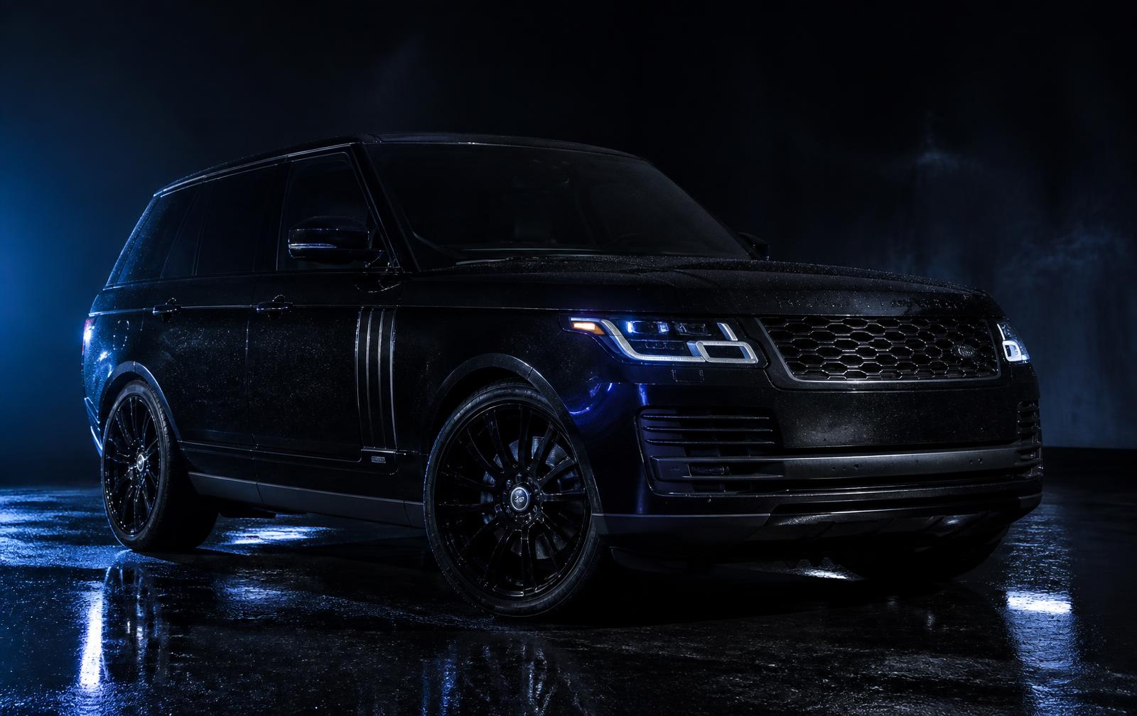 Freshly detailed black SUV gleaming under studio lights