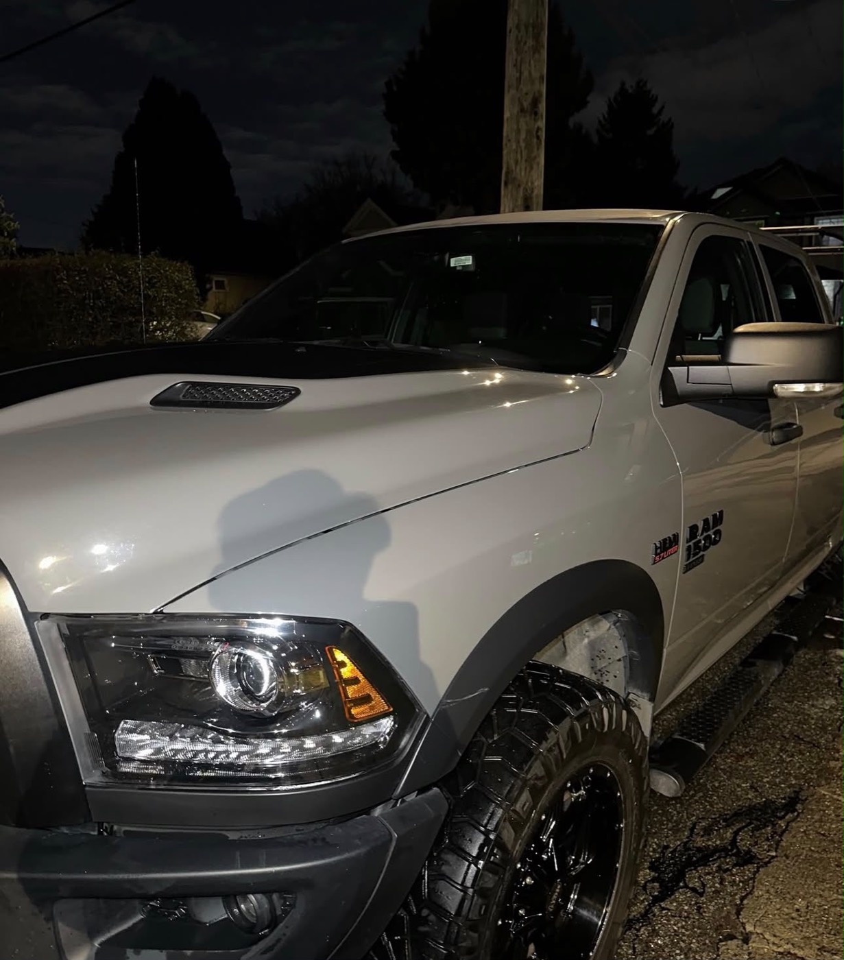 Ram 1500 side glass after ceramic coating, reflecting the sky