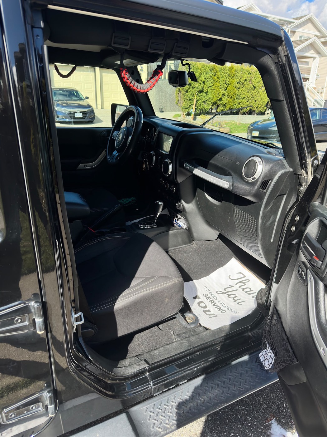 Jeep Wrangler front seats and dash after an interior detail
